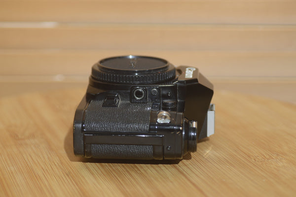 Super rare Black AE1. A fantastic set up for all occasions. Pair it with FD lens - RewindCameras quality vintage cameras, fully tested and serviced