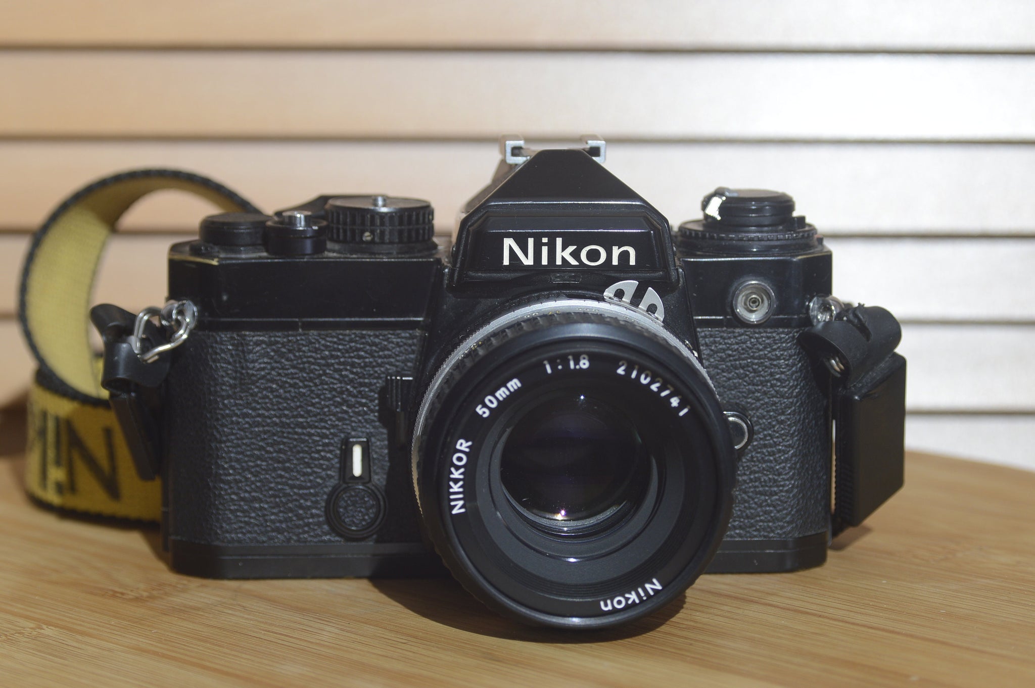 Nikon Black FE With Nikkor 50mm f1.8 Lens Starter Pack. Comes with Lens, Strap and More - RewindCameras quality vintage cameras, fully tested and serviced